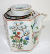 Oriental porcelain kettle decorated in polychrome with flowers, 19th century, 16cm high
