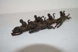 Group of monkey jockeys, metal models with monkeys astride racing dogs, 18cm long