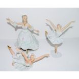 Group of three ballet dancers in various poses