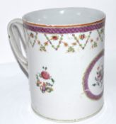 Late 18th century Chinese export porcelain tankard decorated in polychrome with trailing flowers