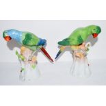 Pair of Continental porcelain models of parrots on tree stumps with Dresden mark to base (2) 17cm