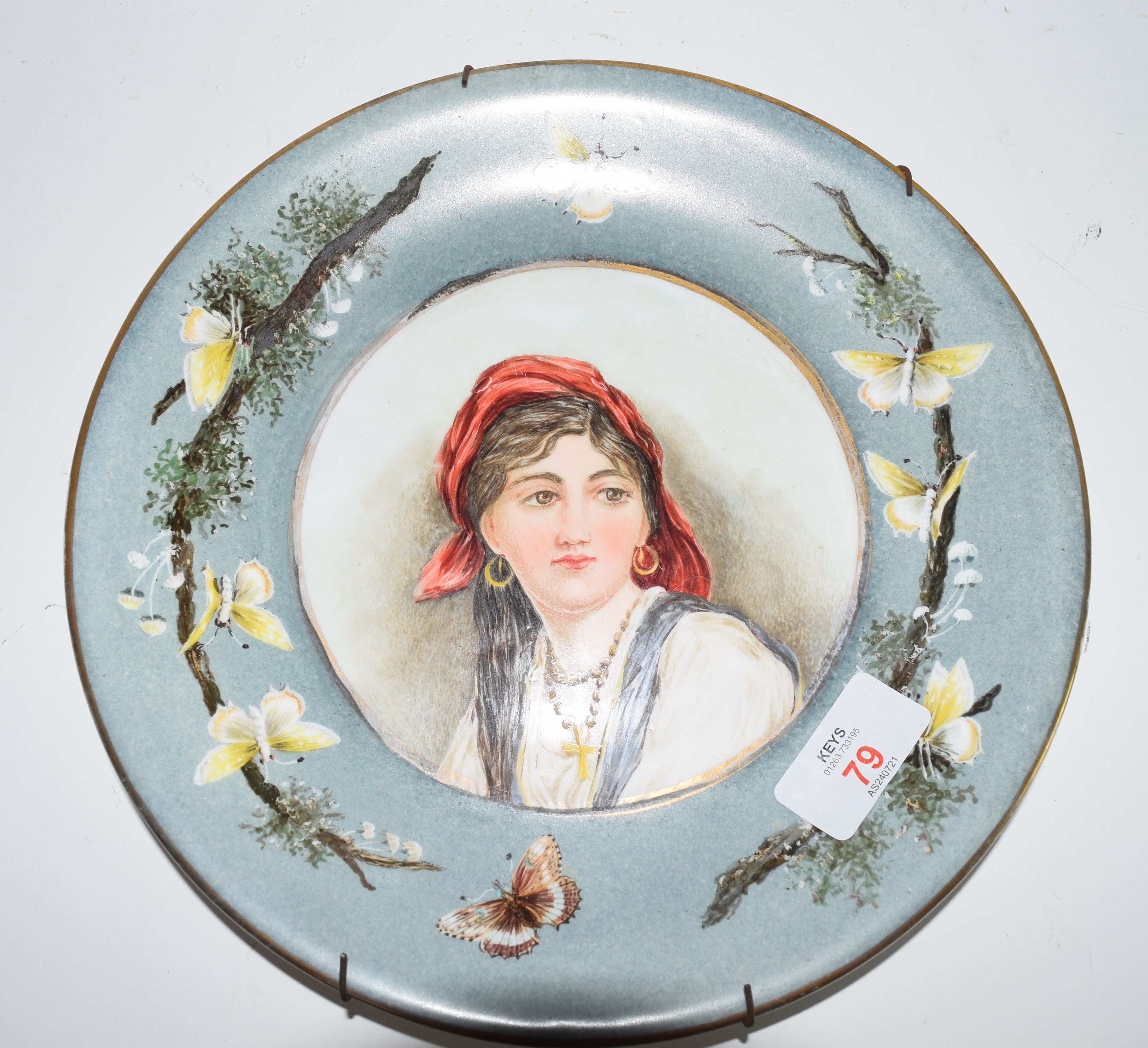 Victorian plate with a hand painted decoration of a young gipsy girl, signed verso