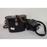 Binoculars in original black leather case and an Olympus camera (2)