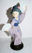 Lladro figure of an Oriental girl as a fan dancer on circular base, impressed 4991, 27cm high