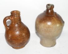 Late 17th/early 18th century globular pottery jug of Bellarmine type with orange peel glaze,