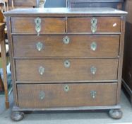 18th century oak chest of two short over three long drawers, raised on bun feet with decorative
