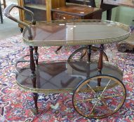 Mahogany effect and gilt decorative tea trolley, length approx 80cm