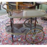 Mahogany effect and gilt decorative tea trolley, length approx 80cm