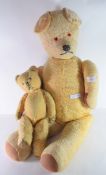 Two teddy bears mid 20th century, with glass eyes in play worn condition