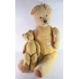 Two teddy bears mid 20th century, with glass eyes in play worn condition