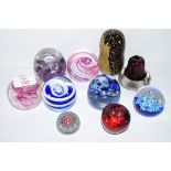 Quantity of paperweights including a Caithness moonflower example, Selkirk Glass example etc (10)