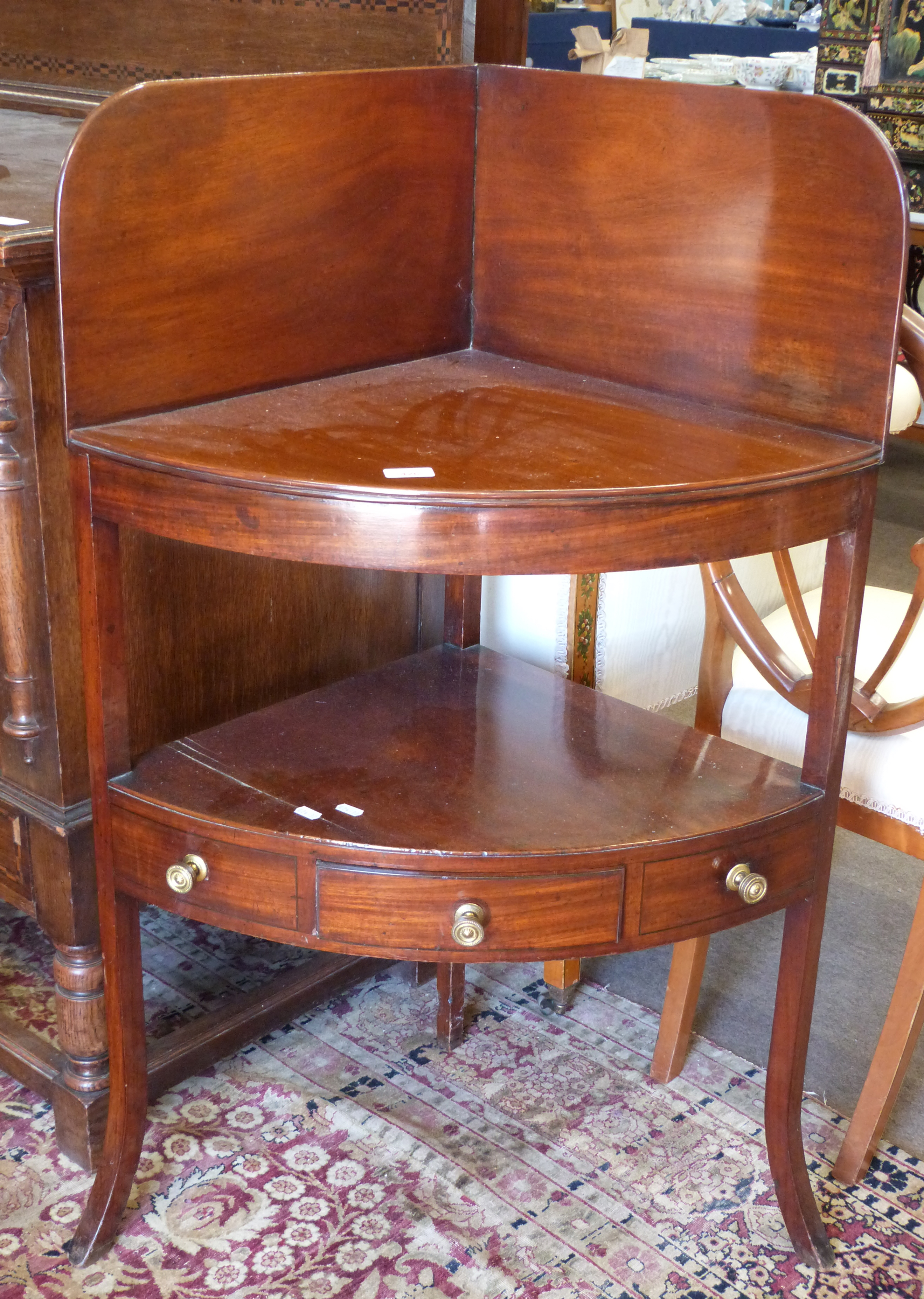 Early 19th century mahogany corner wash stand, fitted with three drawers, width approx 67cm max