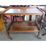 Early 20th century tea trolley with turned legs, length approx 76cm