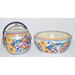 Poole Carter Stabler Adams biscuit barrel with floral design and wicker handle, together with a
