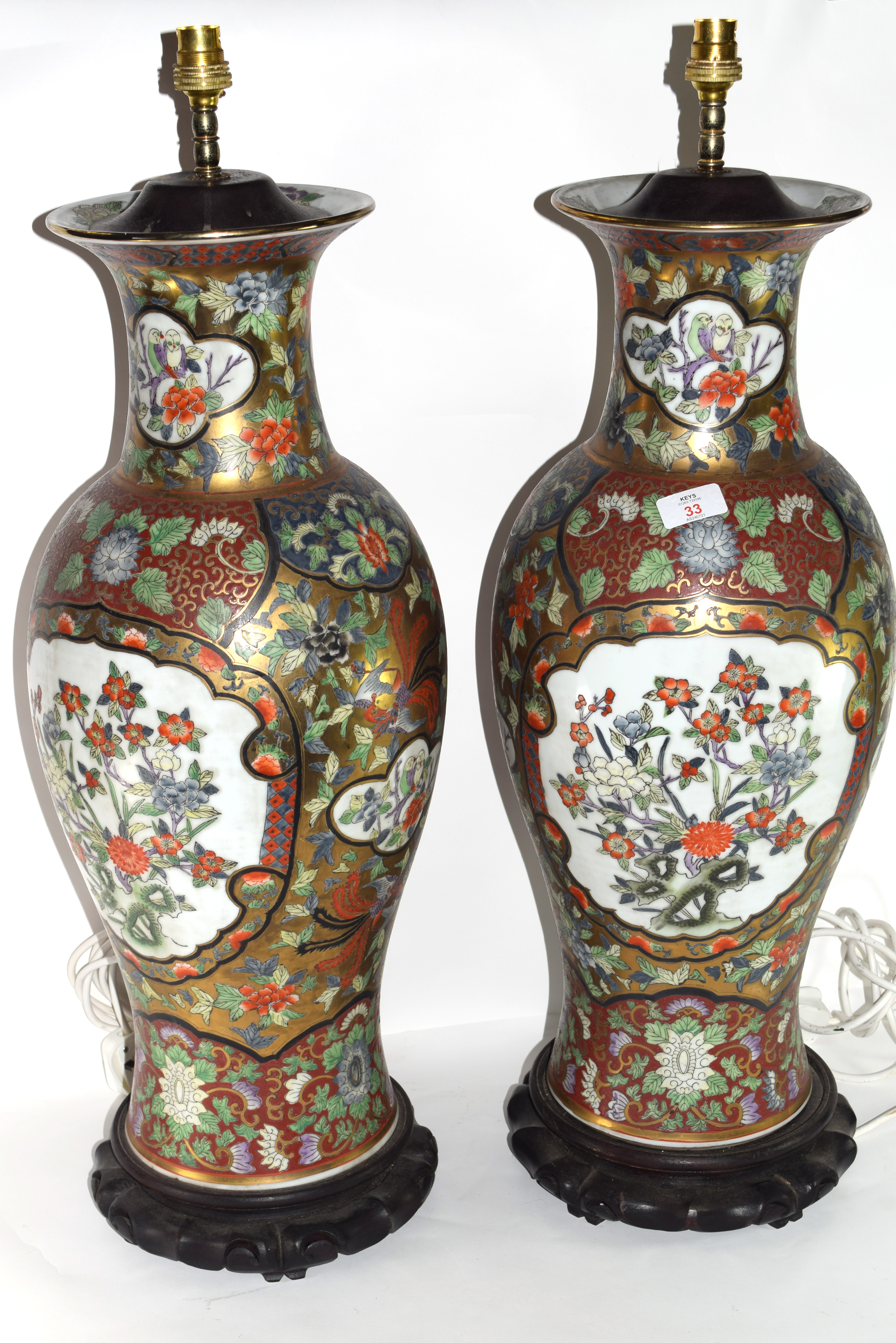 Two modern large Oriental porcelain vases converted to lamps with green and gilt decoration and