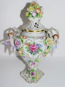 Continental porcelain vase and cover with floral design, the knop with applied flowers, loop handles