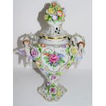 Continental porcelain vase and cover with floral design, the knop with applied flowers, loop handles