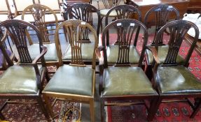 Set of eight (6+2) leather upholstered dining chairs with carved decoration