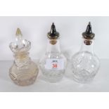 Two cut glass vinegar or oil bottles together with a further hobnail cut glass jar with stopper (3)