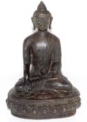 Bronzed metal figure of a Buddha in typical pose