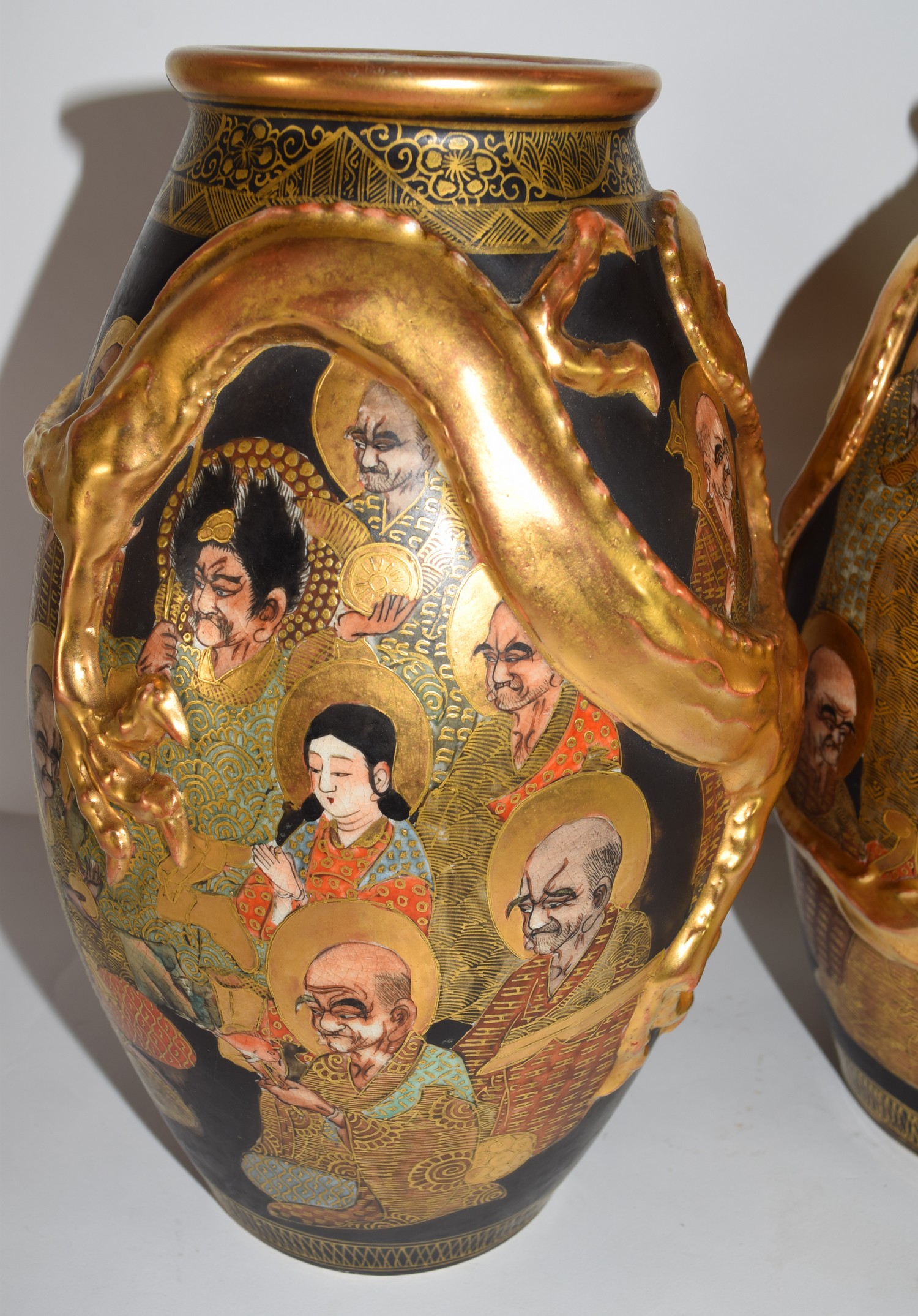 Pair of Satsuma vases, the black ground decorated with sages in gilt, together with dragons modelled - Image 2 of 2