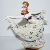 Pair of Art Deco style Continental porcelain dancers on shaped base, 19cm high