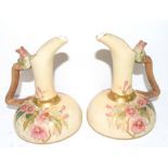 Pair of Continental ewers modelled in Royal Worcester style with the blush ground with floral