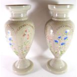 Pair of glass vases with an applied design of flowers in beaded reserves, 37cm high (2)