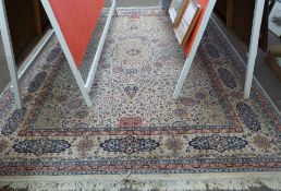 Wool carpet, beige coloured ground, blue and foliate pattern, gulled border, 12 x 9ft