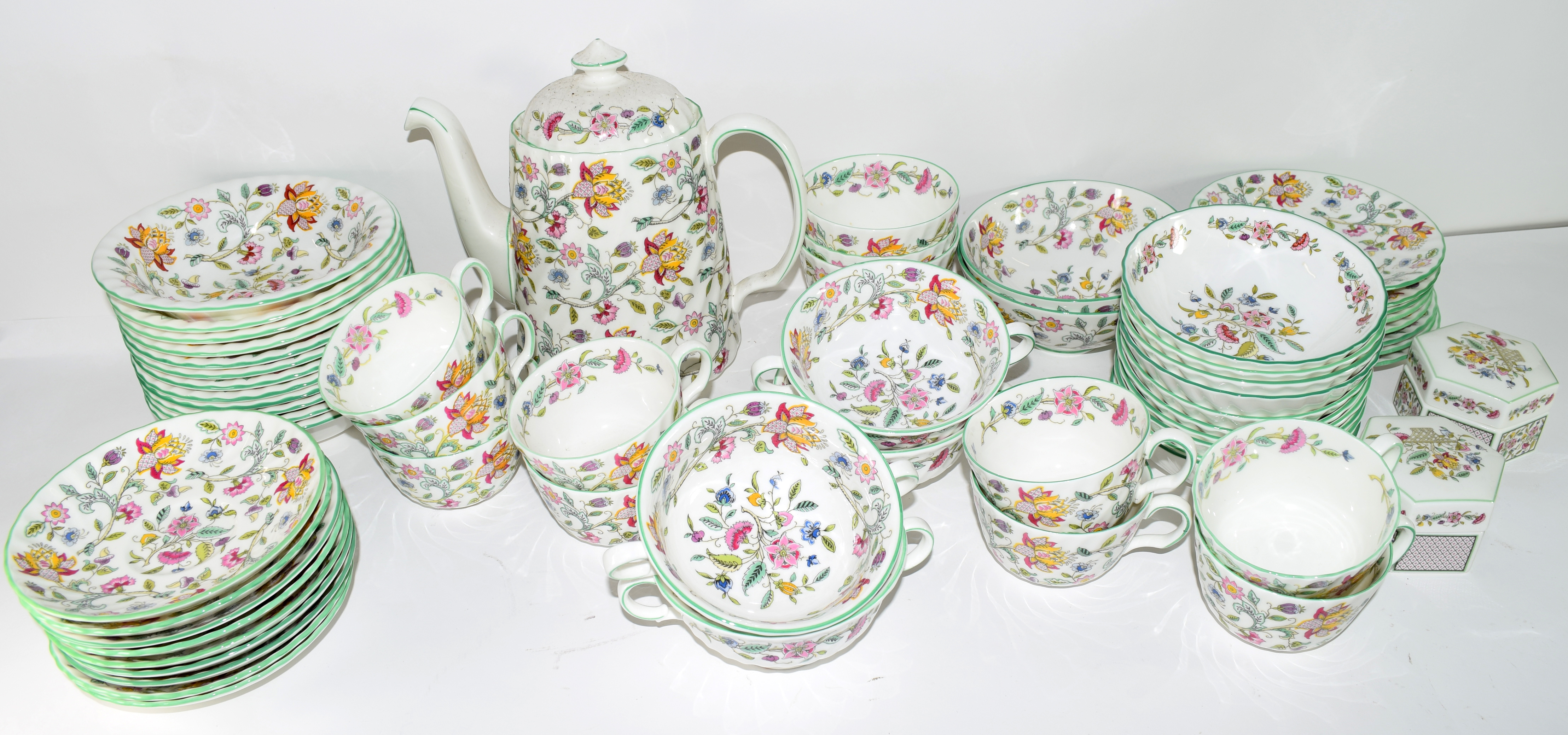 An extensive quantity of dinner and tea wares by Minton in the Haddon Hall pattern comprising 10