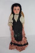 Late 19th century doll manufactured by S F B J marked to rear of head, child possibly in national