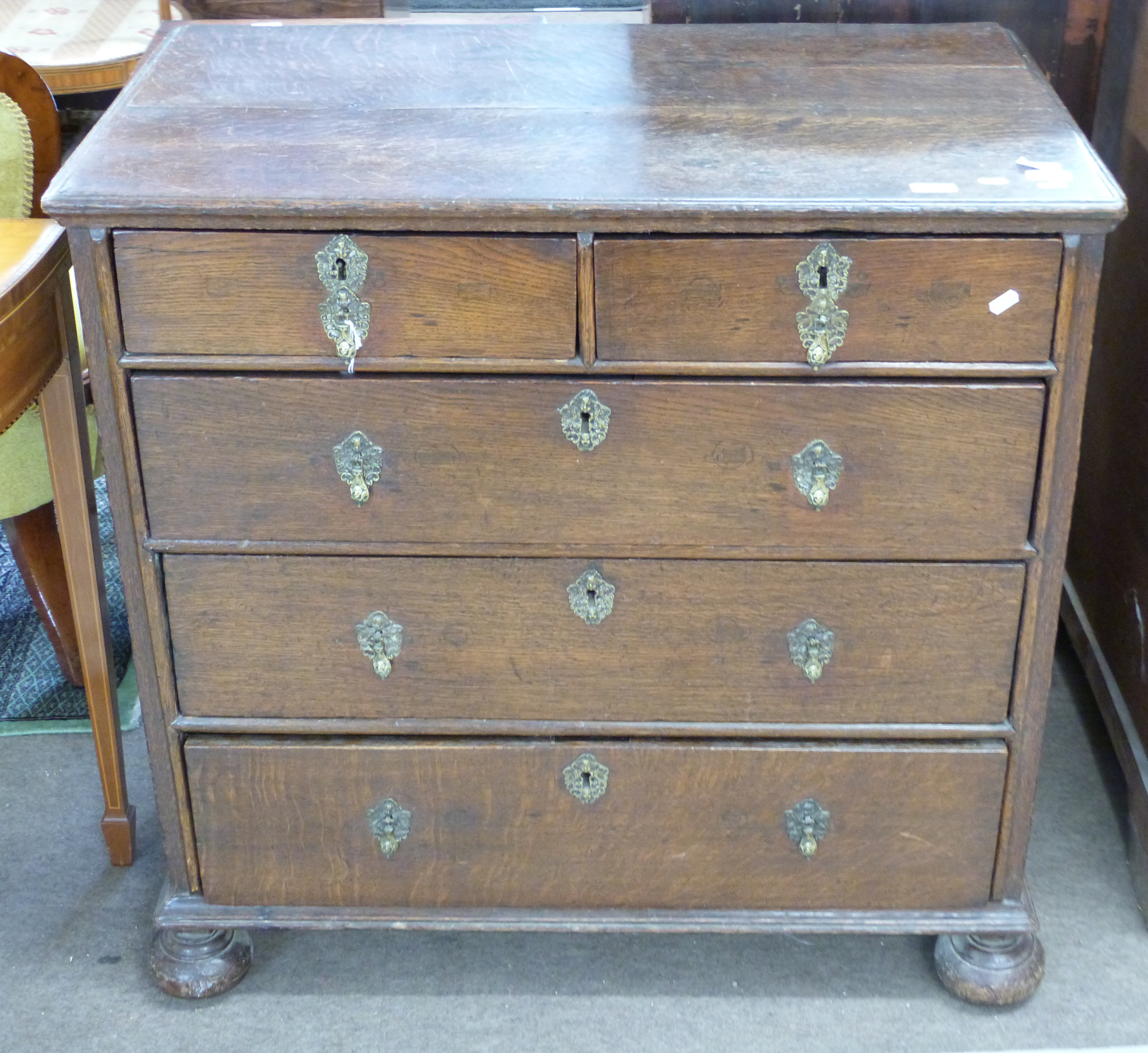 18th century oak chest of two short over three long drawers, raised on bun feet with decorative - Image 2 of 3