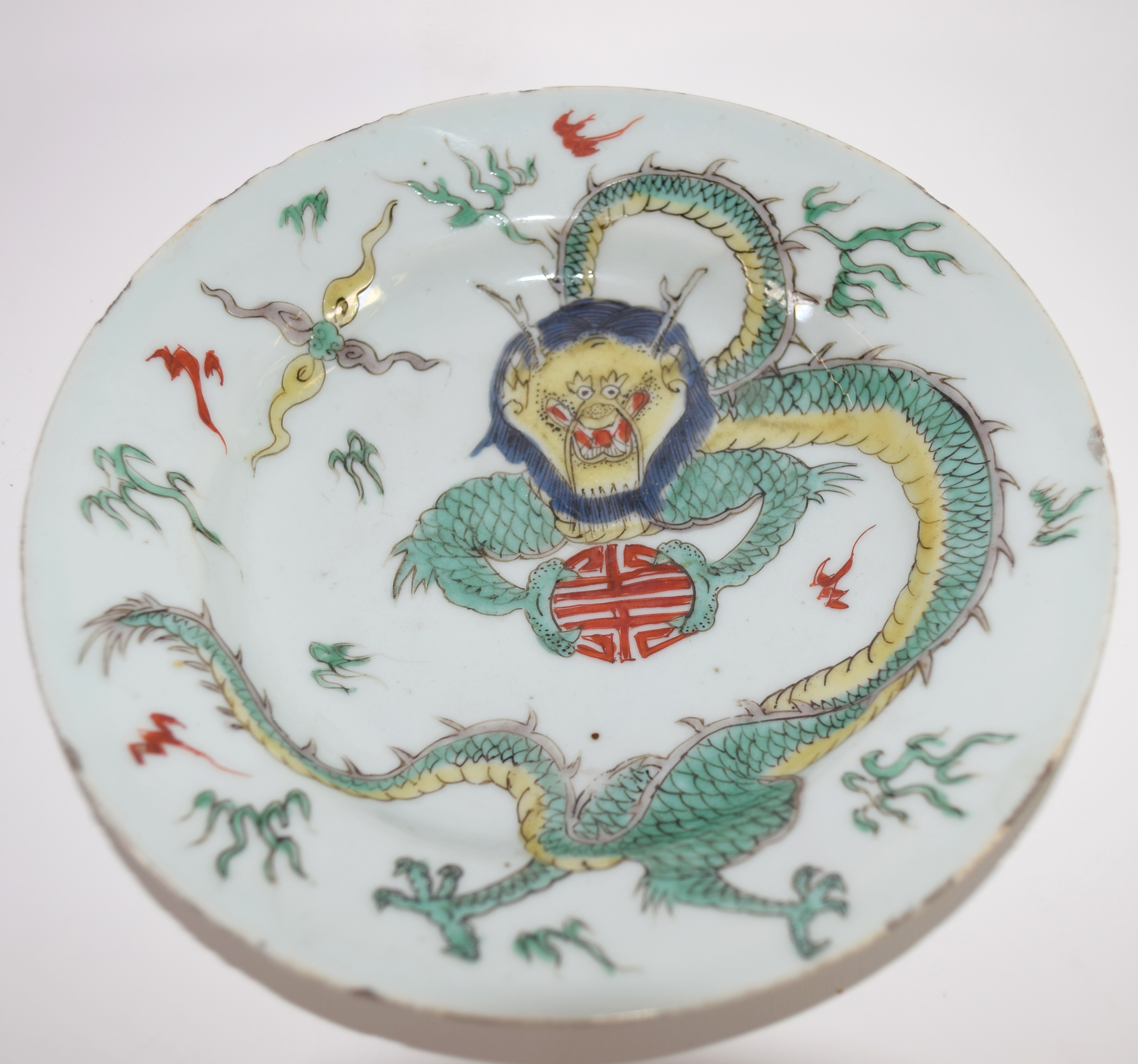 Small Chinese porcelain plate, probably Kangxi, decorated in famille vert enamels with a dragon