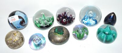 Group of paperweights, some aquamarine Isle of Wight glass, Caithness moonflower plus one other