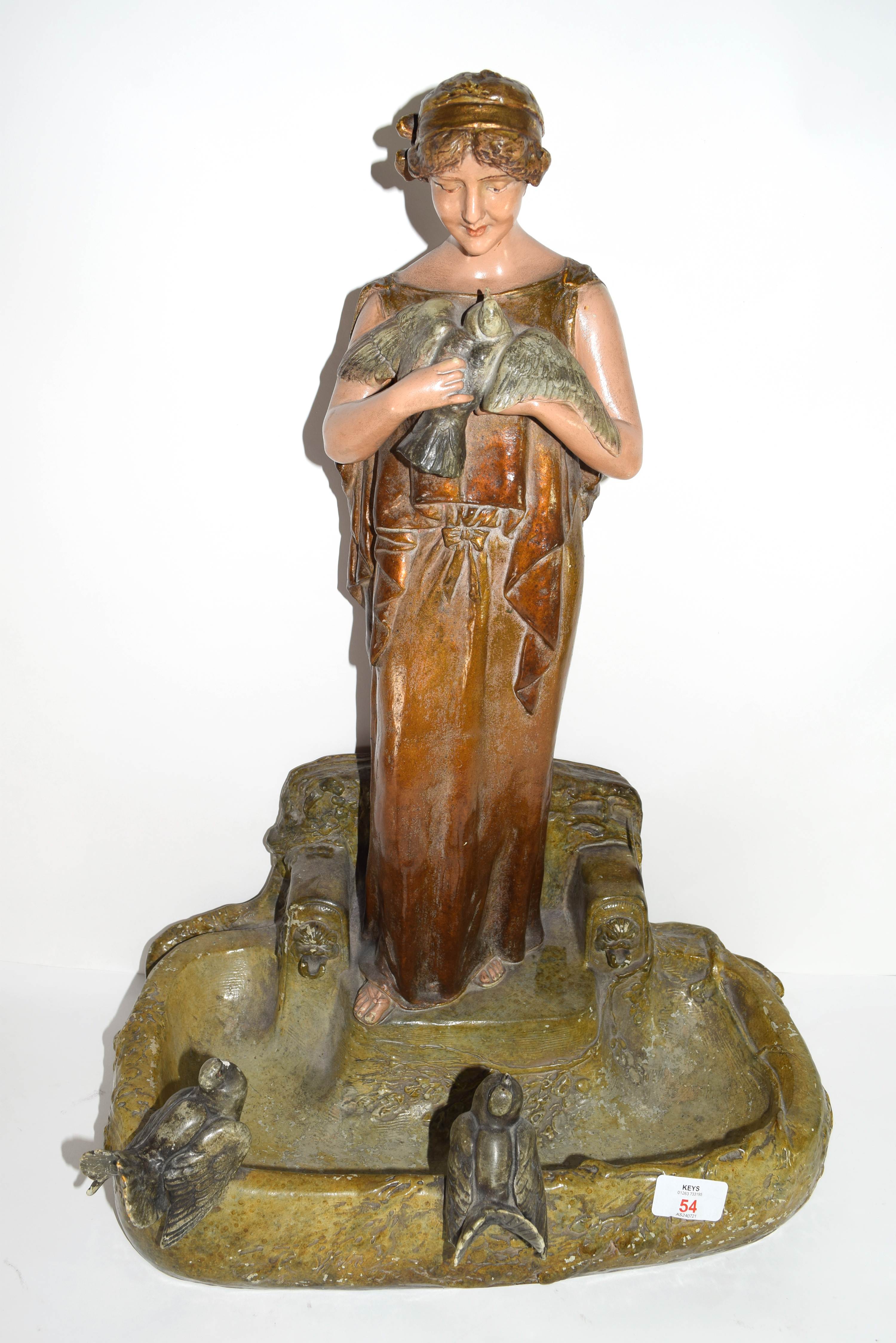 Art Nouveau plaster bird bath modelled as an Art Nouveau lady holding a bird in Royal Dux style with