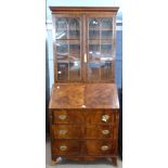 Late Georgian mahogany bureau bookcase, the top section with concave sided cornice above two glass