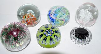 Group of paperweights including a Langham example signed by Paul Miller, Strathearn and a millefiori