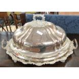 Large decoratively moulded silver plated serving tray together with similar cover