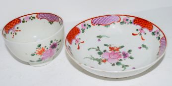 Lowestoft tea bowl and saucer, polychrome design of floral sprays (tea bowl cracked)