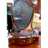 Edwardian shield-shaped toilet mirror raised on a serpentine three drawer base with ivory