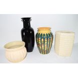 Group of four pottery vases of various shapes and designs