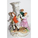 Continental porcelain candlestick in Meissen style decorated with children dancing around a