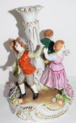 Continental porcelain candlestick in Meissen style decorated with children dancing around a