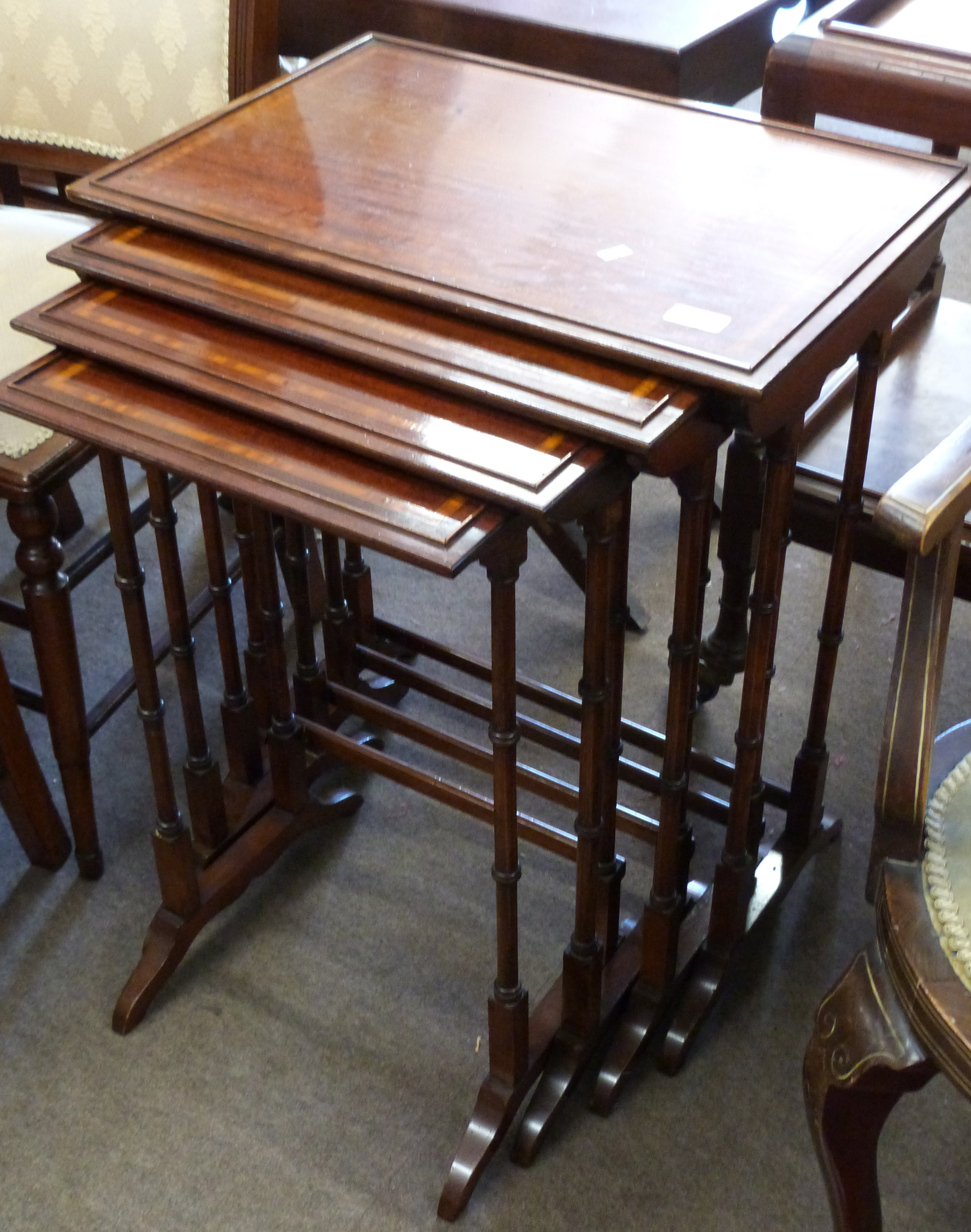 Nest of four inlaid mahogany tables, the largest approx 56 x 38cm