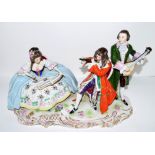 Large Continental porcelain group of musicians on scroll base, 35cm long