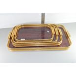 SET OF FOUR MATCHING BRASS TRAYS