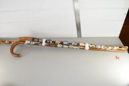 THREE WALKING STICKS WITH COLLECTION OF BADGES