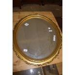 GILT FRAMED OVAL WALL MIRROR, APPROX 74 X 64CM