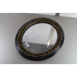 VINTAGE BLACK AND GILT OVAL WALL MIRROR, APPROX 40 X 36CM