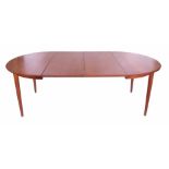 An extending circular dining table with two inset additional leaves, of Danish design, together with